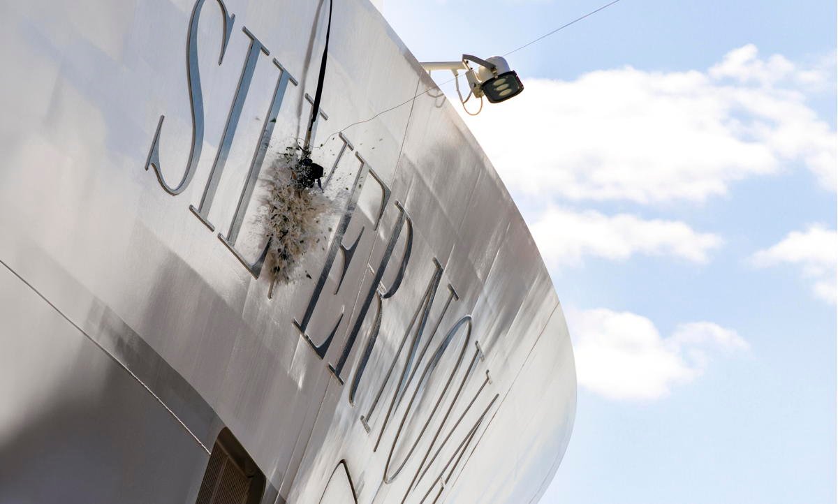 A magnum-sized bottle of champagne smashes on Silver Nova's hull. (Silversea)