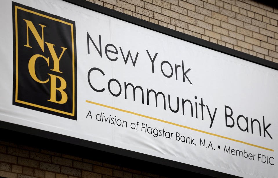 FILE PHOTO: A sign is pictured above a branch of the New York Community Bank in Yonkers, New York, U.S., January 31, 2024. REUTERS/Mike Segar/File Photo