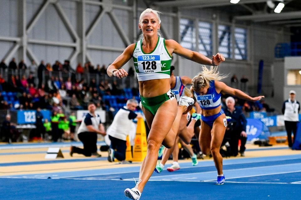 Sarah Lavin crosses the finish line to win the senior women's 60m hurdles