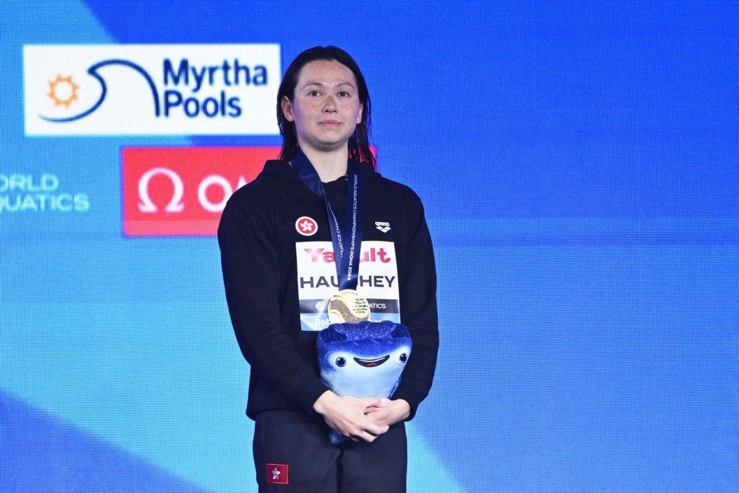 Hong Kong's gold-medallist Siobhan Bernadette Haughey poses on the podium of the women's 200m freestyle swimming event during the 2024 World Aquatics Championships at Aspire Dome in Doha on February 14, 2024. Photo: Oli Scarff/AFP.