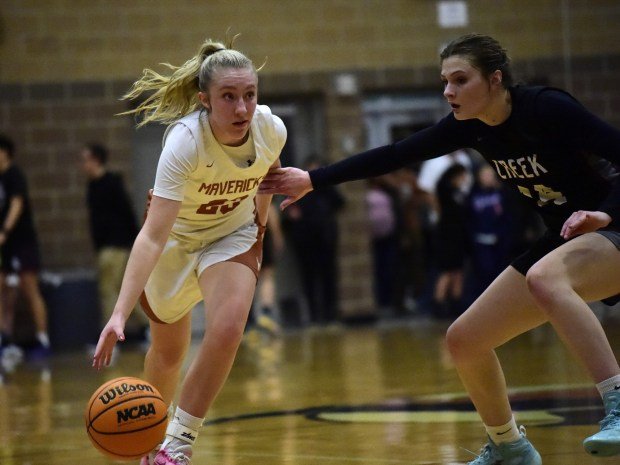 LONGMONT: Mead's Madi Clark dribbles with Silver Creek's Izzy Spagnoletti pressuring Friday, Feb. 2, 2024. (Photo by Brent W. New/BoCoPreps.com)