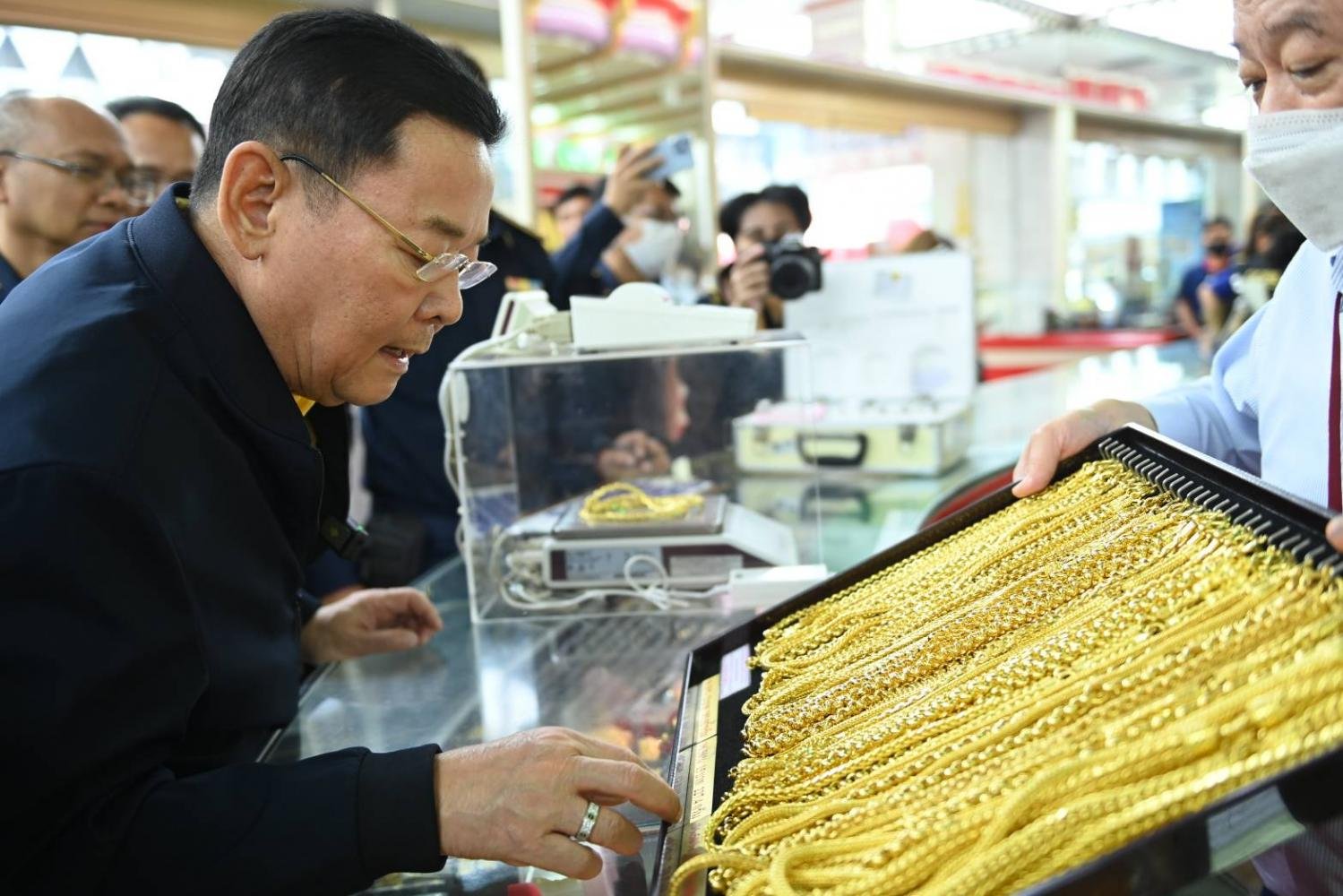 Gold ornaments are inspected at a gold shop in the Yaowarat area of Bangkok on Friday.