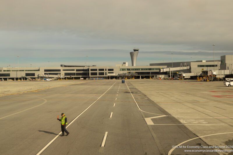 a man walking on a runway