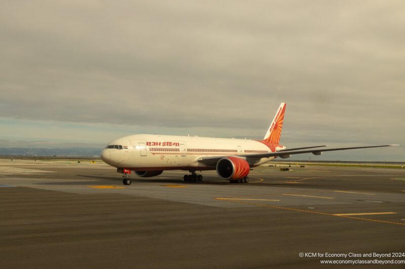 a white airplane on a runway