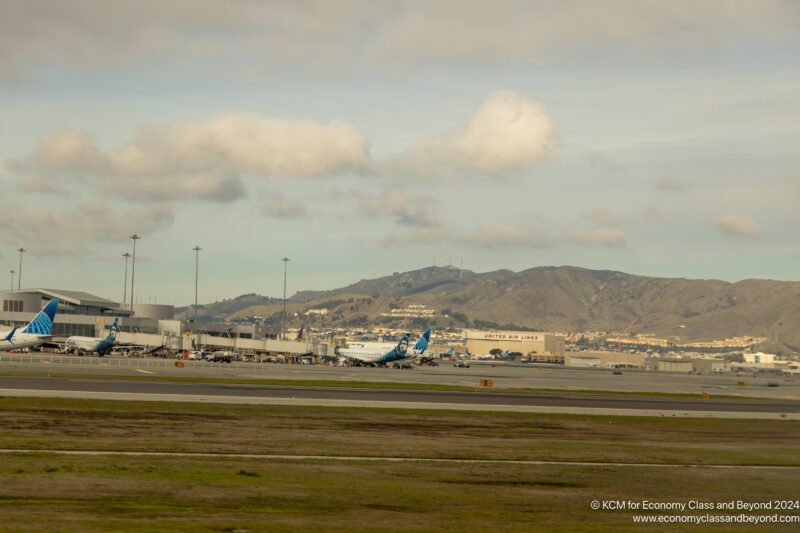 an airport with a mountain in the background