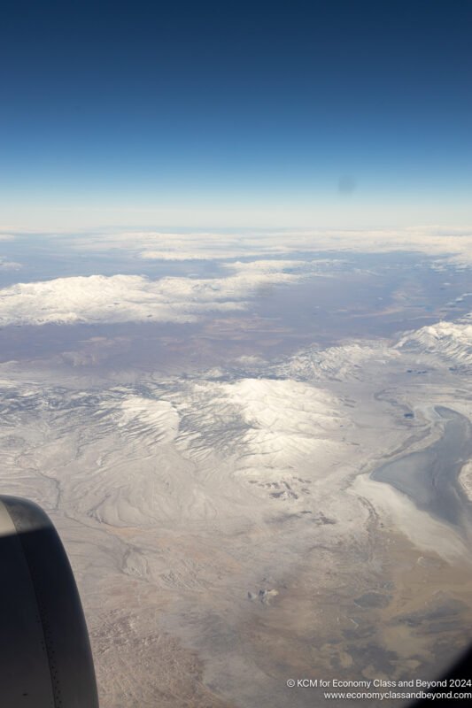 an aerial view of snow covered mountains