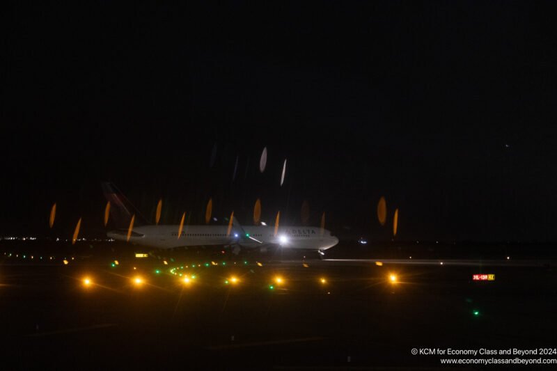 an airplane on the runway at night