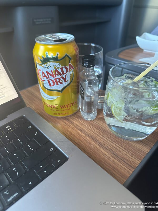 a drink and a glass of water on a table