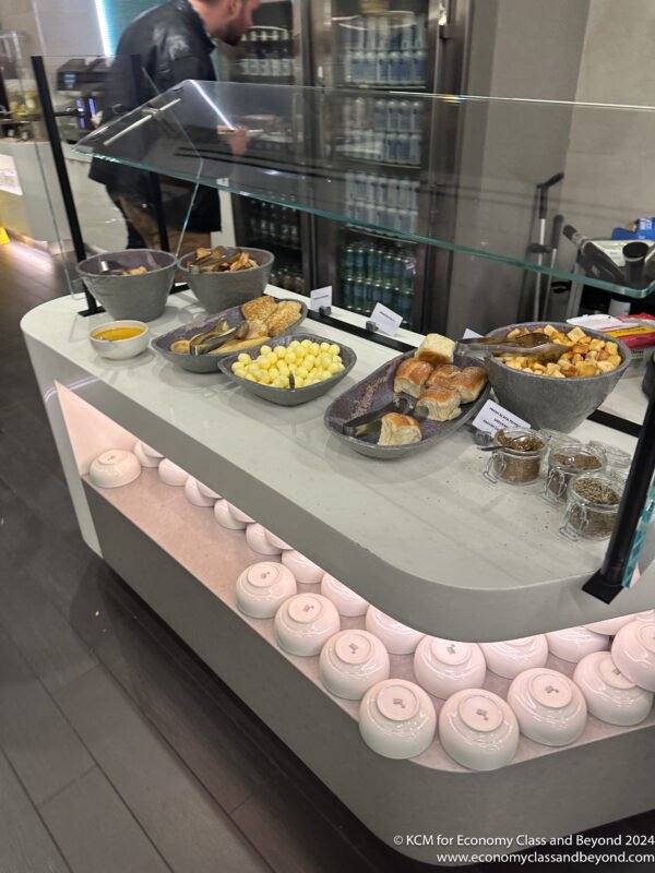 a counter with bowls of food on it