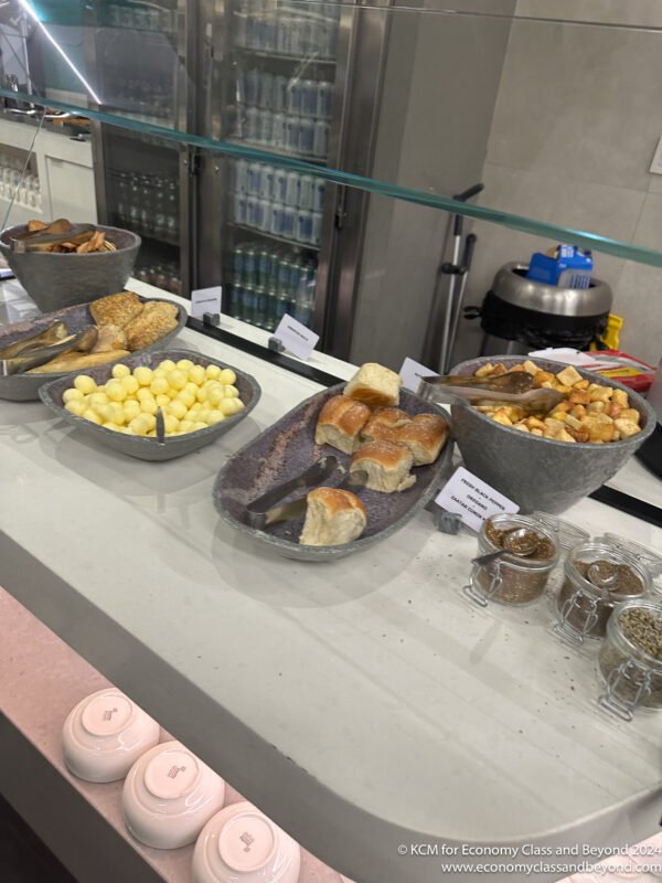 a group of bowls of food on a counter