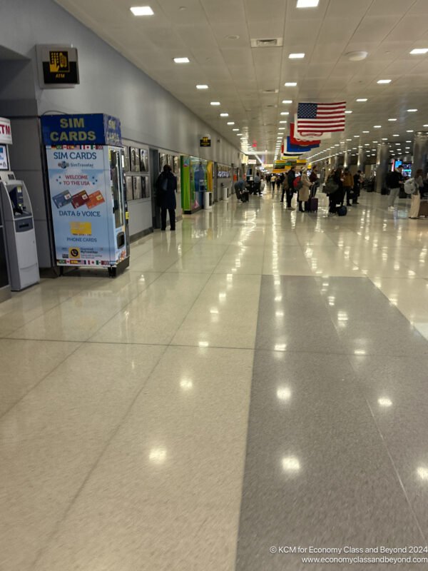 people in a terminal with people walking