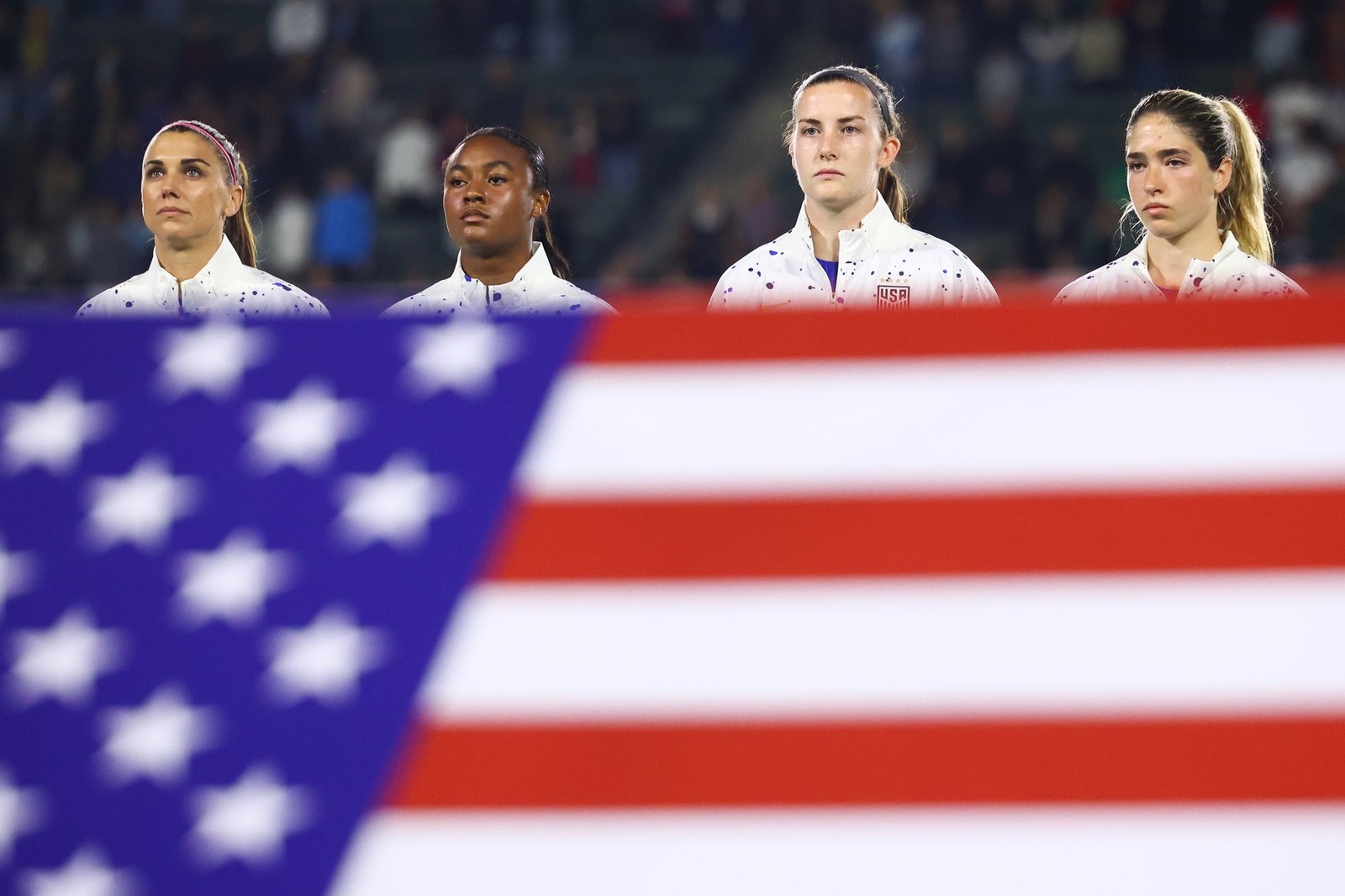 USWNT behind the U.S. flag before a game