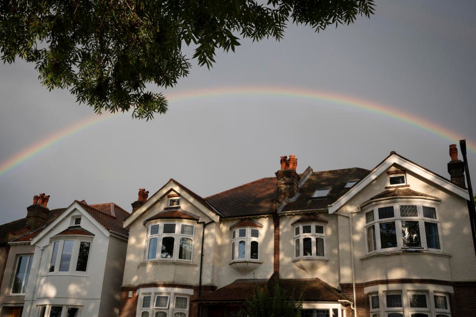 A rainbow arcs over suburban residential properties in south London, on 26th August 2023, in London, England. (Photo by Richard Baker / In Pictures via Getty Images)