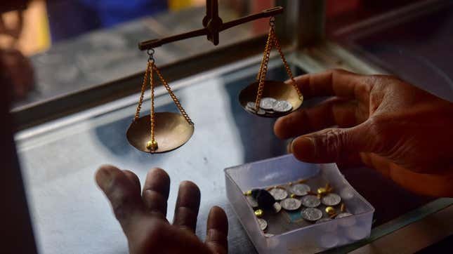 A local buyer weighing gold that was brought in by small scale miners on March 22, 2017 in Paracale, Philippines. In the mining town of Paracale, about 350 kilometers south of Manila, a day's work of digging and sifting through hundreds of kilos of sand and clay, an artisanal miner can gather about a quarter of a gram of gold dust, enough to earn $5, enough for a family to go through the day's needs. For decades, local residents at Paracale town work in hazardous conditions scavenging under the earth and diving into tunnels filled with mud using only makeshift tools to mine for gold, often placing their health and lives at risk. Ban Toxics, a local NGO working at these sites claims that artisanal mining is a poverty driven industry and that small-scale miners typically work in harsh conditions with no proper training, protection, and pollution control methods. Local reports indicated the country produced about 18 tons of gold at a market value of over $700 million in 2014 while 80% of the gold comes from artisanal and small-scale mines which operate without a government license. The Philippines holds the largest copper-gold deposit in the world and is the fifth most mineral-rich country for gold, nickel, copper, and chromite, but massive environmental destruction prompted the new Department of Environment and Natural Resources secretary, Gina Lopez, to threaten many large-scale mining operations for closure.