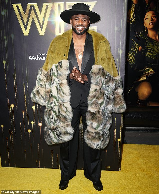 He donned a classic black suit but chose to not wear a shirt underneath. Wayne additionally wore a fuzzy coat that comprised of hues such as olive green and light brown