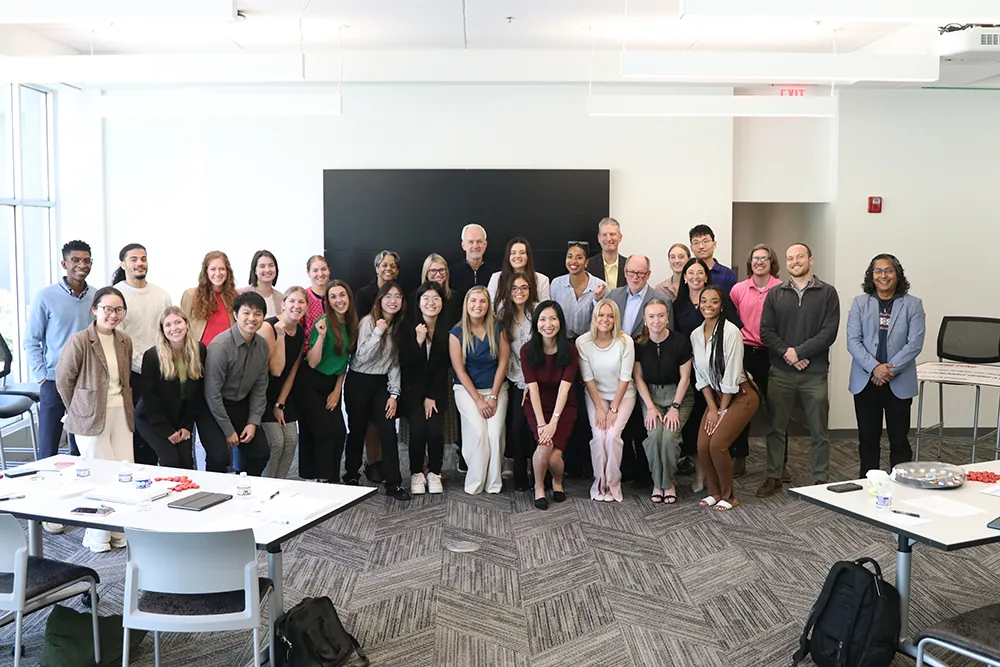 Students and industry professionals pose for picture. 