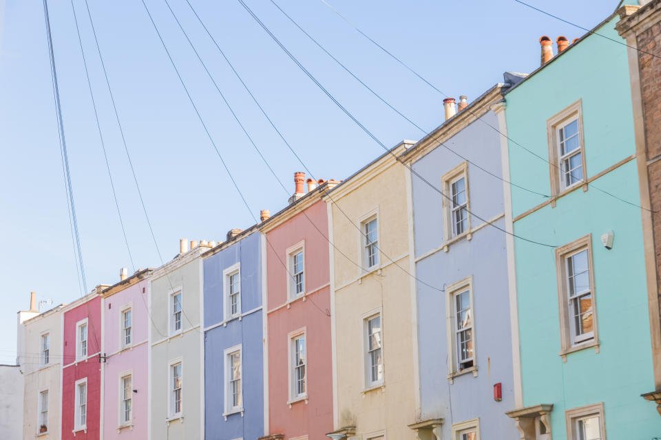 pastel coloured terraced houses in Cliftonwood, Bristol, England Property