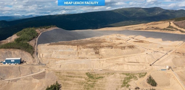 A remote mine site with the label "heap leach facility" at the top of the photo.