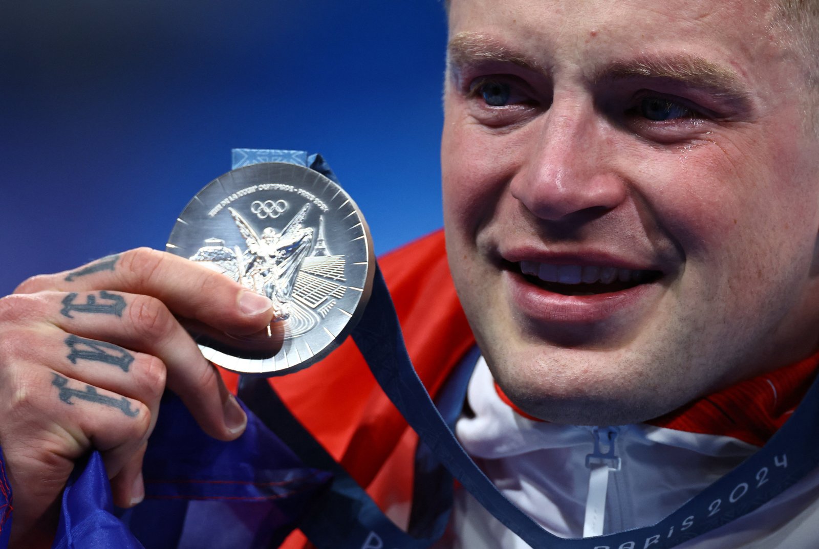 Adam Peaty of Britain celebrates after the race