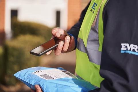 Evri driver scanning parcel