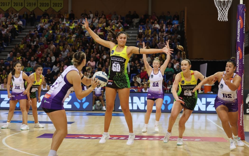 Pulse's Parris Mason (Centre L) with team mate captain Kelly Jackson (Centre R), Stars' Emma Thompson (L) and Maia Wilson (R during the ANZ Premiership Wellington Pulse vs Stars netball match at the Te Rauparaha Arena in Wellington. 23 June 2024. © Copyright image by Marty Melville / www.photosport.nz