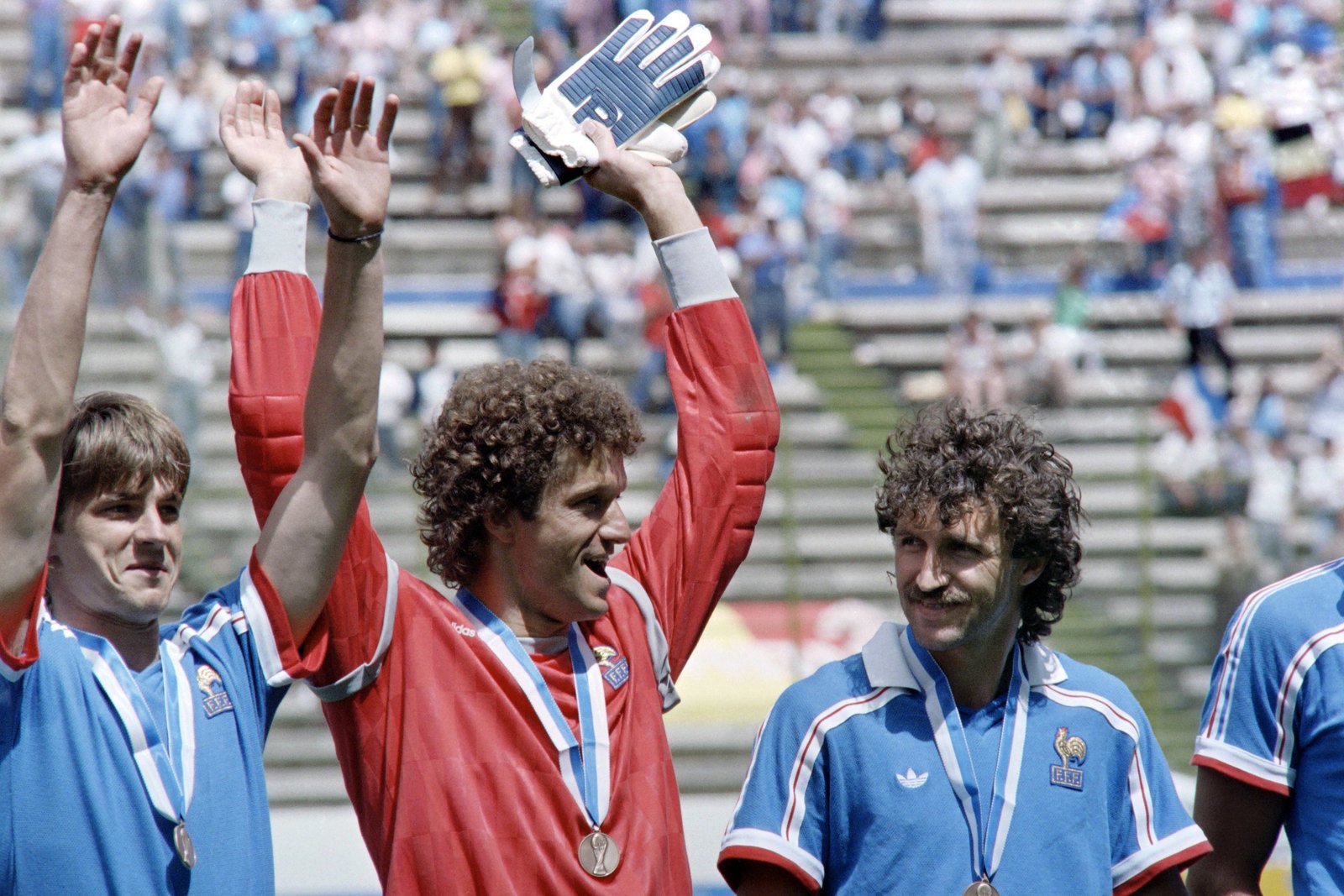 Albert Rust raises his hands after France beat Belgium to finish third at the 1986 World Cup.