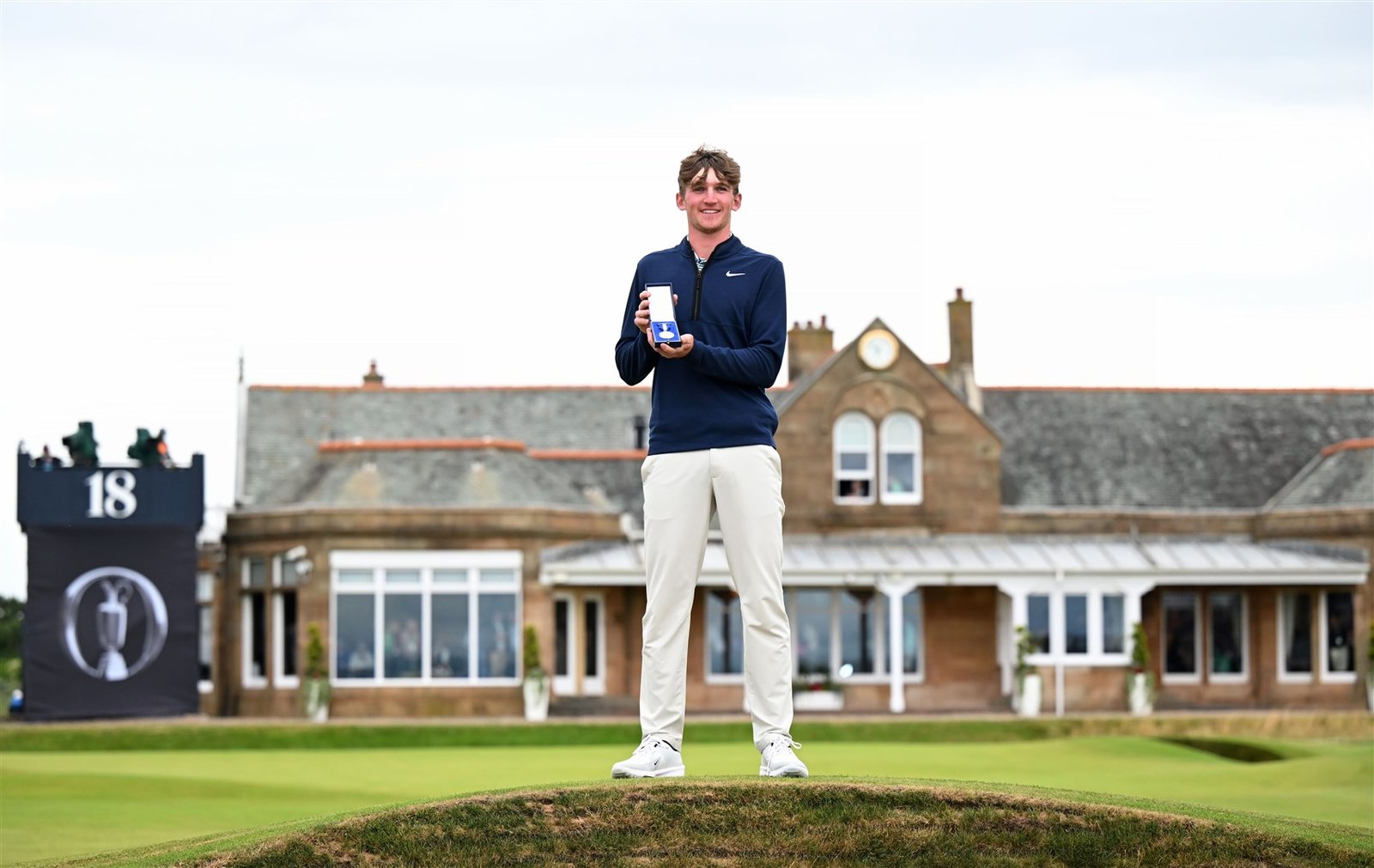 TROON, SCOTLAND - JULY 21: Calum Scott poses with the Silver Medal on the 18th green on day four of The 152nd Open championship at Royal Troon. Photo: Luke Walker/R&A/R&A via Getty Images)