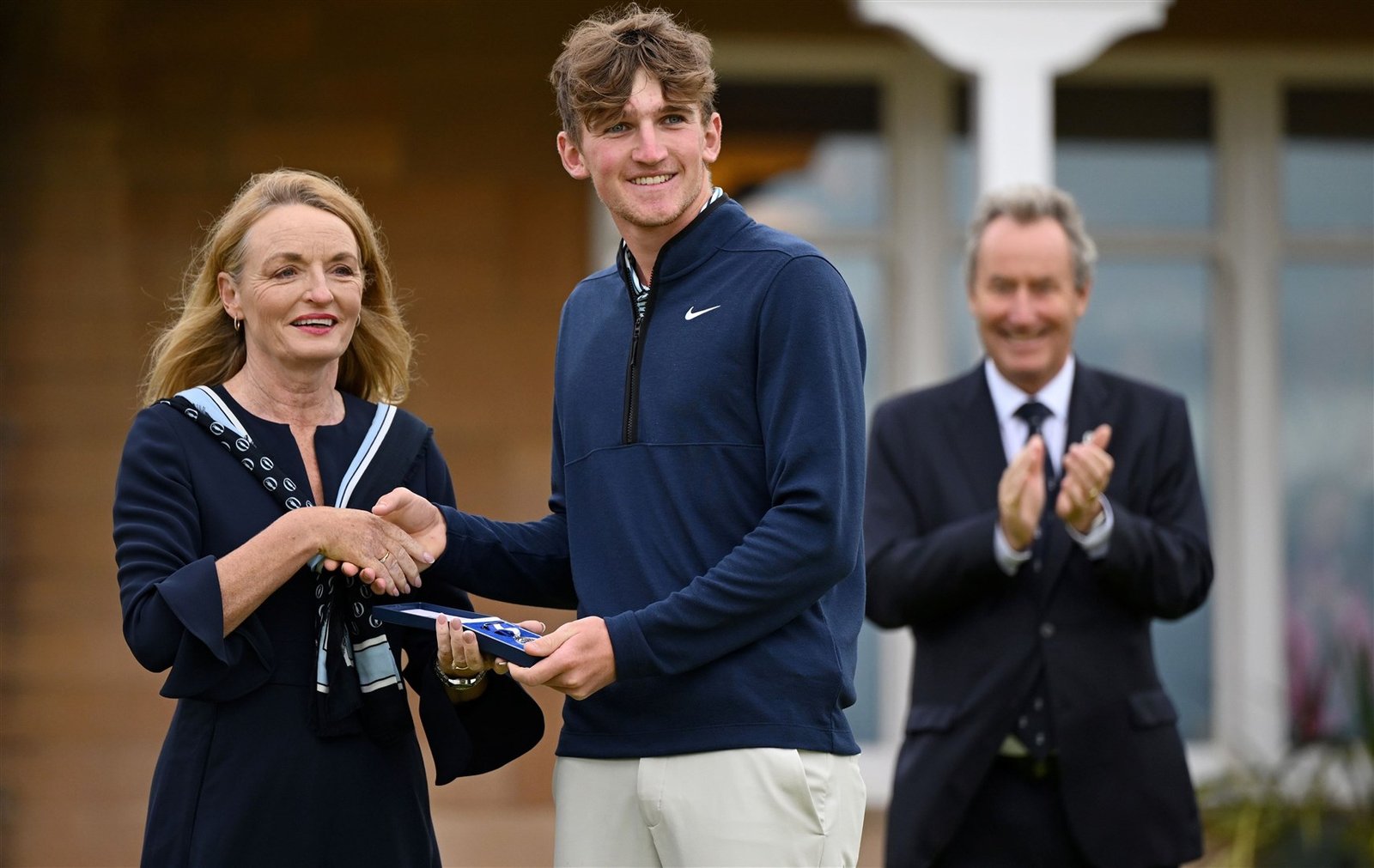 Calum Scott is presented with the Silver Medal on the 18th green on day four of The 152nd Open championship at Royal Troon. Photo: Oisin Keniry/R&A/R&A via Getty Images)