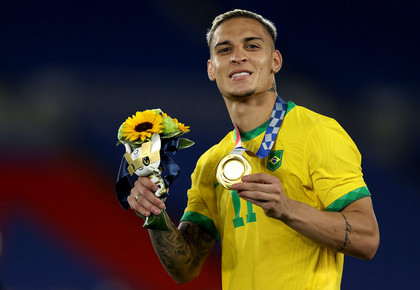 Antony celebrates with his gold medal after Brazil's win over Spain in the final of the men's football tournament at the 2020 Olympics in Tokyo.