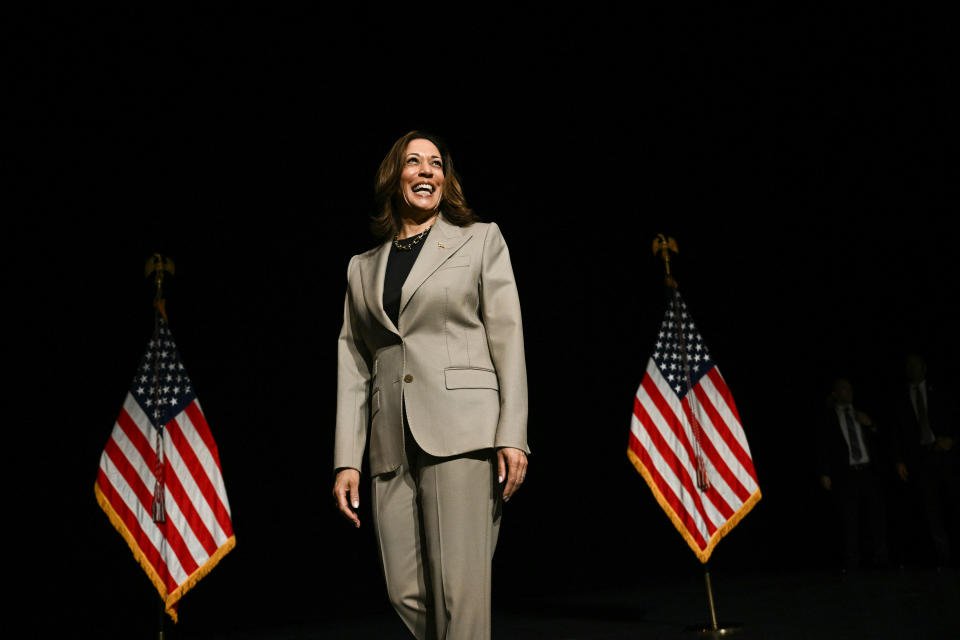 TOPSHOT - US Vice President and Democratic presidential candidate Kamala Harris walks on stage in the overflow room after speaking at Prince George's Community College in Largo, Maryland, on August 15, 2024. (Photo by Brendan SMIALOWSKI / AFP) (Photo by BRENDAN SMIALOWSKI/AFP via Getty Images)