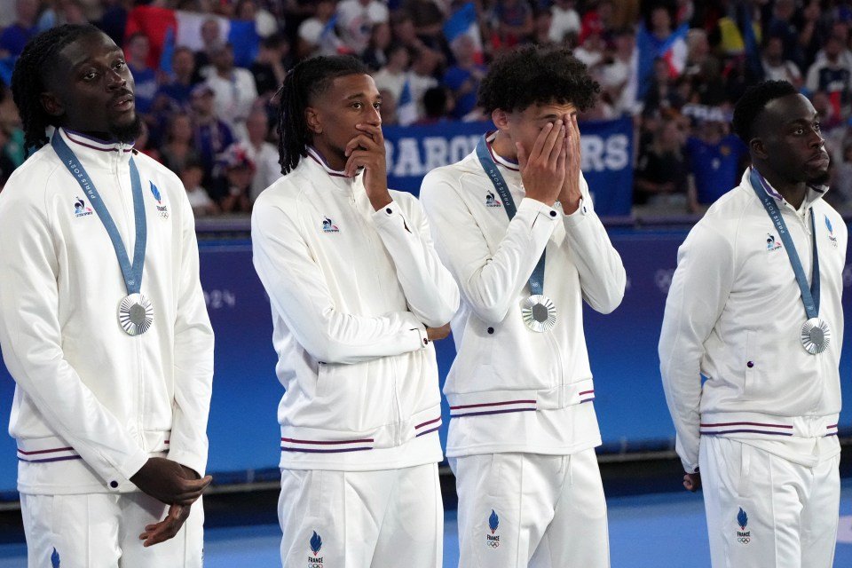 Thierry Henry's troops cut dejected figures as they were awarded their silver medals