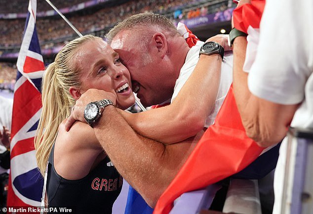 Hodgkinson was embraced by her father Dean in the crowd following her triumph in Paris