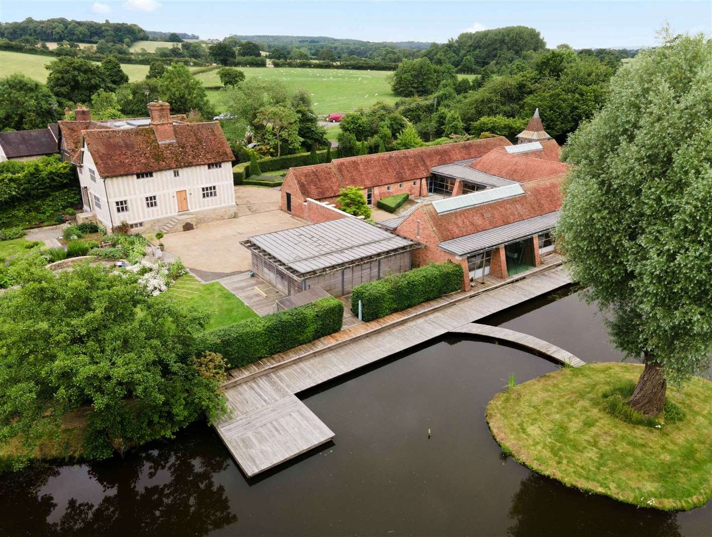 Aerial shot of the site. Below left, the offices and below right, one of the reception rooms at the house.