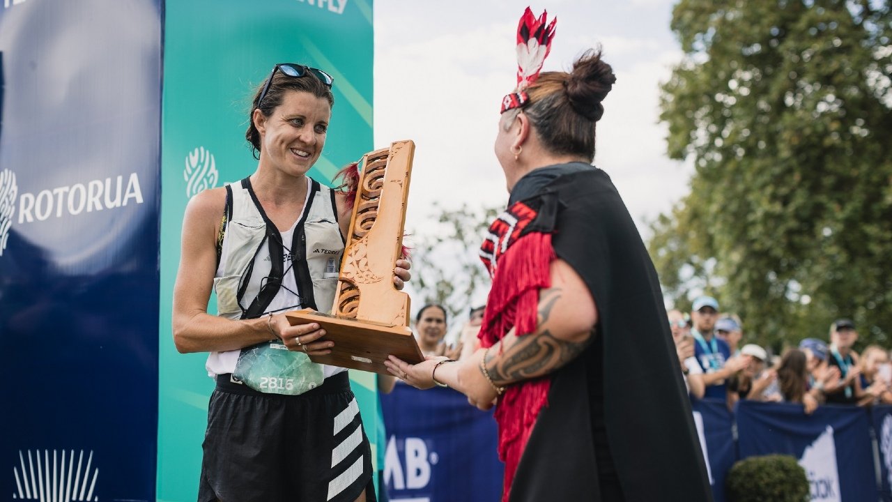 Ruth Croft receiving the women's 102km Tarawera Ultra-Trail by UTMB trophy after her victory Photo credit: Cameron McKenzie