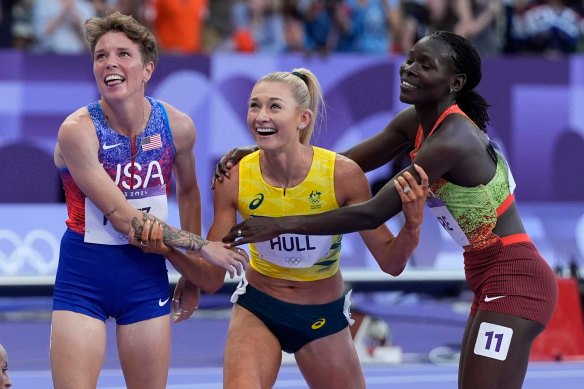 Nikki Hiltz and Susan Lokayo Ejore congratulate Jess Hull on her silver medal.