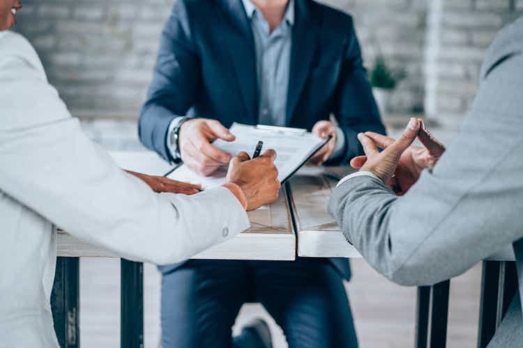 Couple meeting with financial advisor.