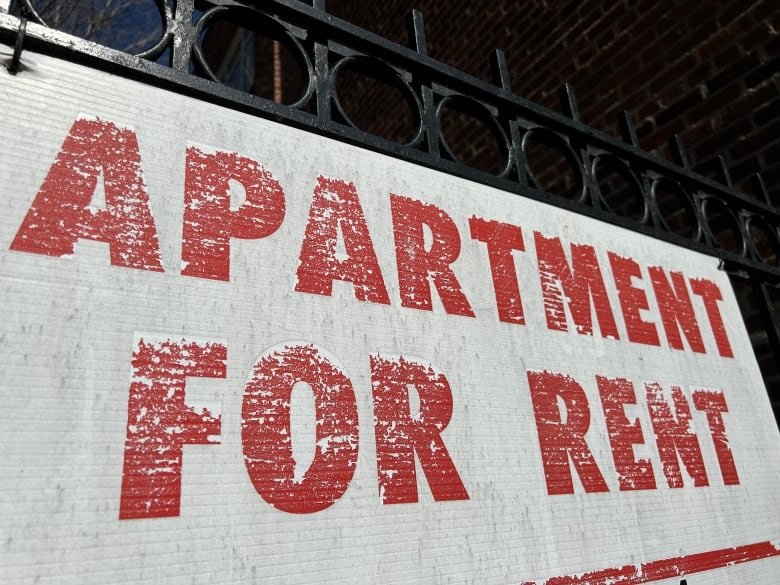 An "apartment for rent" sign is shown. 