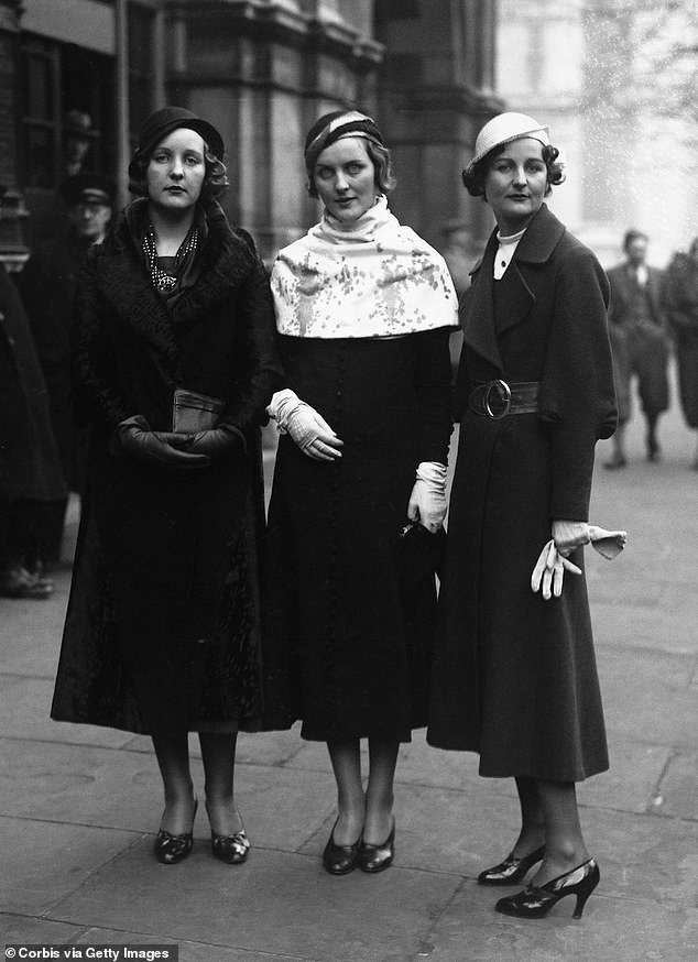 Three of the Mitford sisters as guests at the wedding of Lord Stanley of Aldernay and Lady Audrey Talbot in 1932. English Nazi sympathizer Unity Mitford (l) with her sisters, novelist Nancy Mitford (r) and Diana Mitford (c)