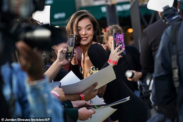 The actress happily stopped along the red carpet to snap selfies and sign autographs for fans