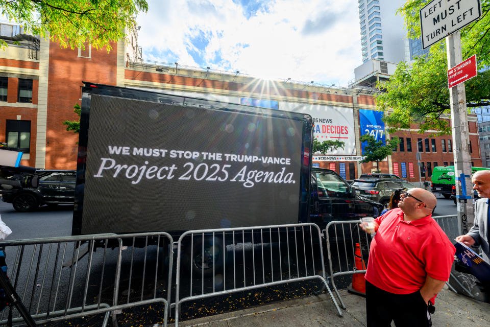 NEW YORK, NEW YORK - OCTOBER 01: A truck with a billboard tying J.D.Vance to Project 2025 is seen outside the CBS broadcast center where the Vice presidential debate is set to occur in Manhattan on October 01, 2024 in New York City. (Photo by Roy Rochlin/Getty Images for DNC)